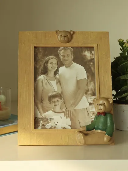 A classic family photo finds a charming home in our teddy bear frame. The antique gold finish and sweet bear detail add a touch of warmth and nostalgia to your decor.