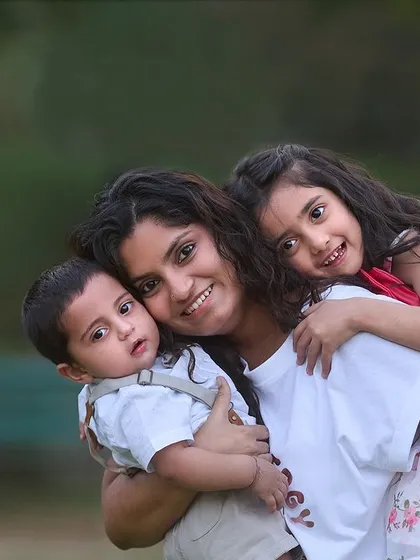 A mother's embrace, filled with love for both her children. I specialize in making sure everyone feels comfortable, allowing me to capture beautiful group portraits even with toddlers and infants together.