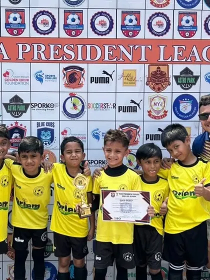 Our U-7 team with their coaches and a well-earned trophy at the Yuva President League. A proud moment for our youngest players.