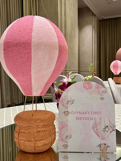 The little details make the party. For Zaynab's hot air balloon themed first birthday, we created these charming miniature hot air balloon centerpieces to match the main decor.