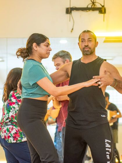 Sai demonstrating a partner work technique with a student during the workshop. We believe in hands on feedback to ensure everyone understands the movement.