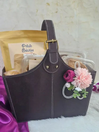 This elegant faux leather basket is a great option for corporate hampers. We can customize the contents according to your budget and deliver across India.