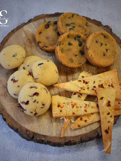 A beautiful flat-lay of the three types of cookies taught in our masterclass: Rose & Coconut, Belgian Sea Salt, and Cheese & Spice.
