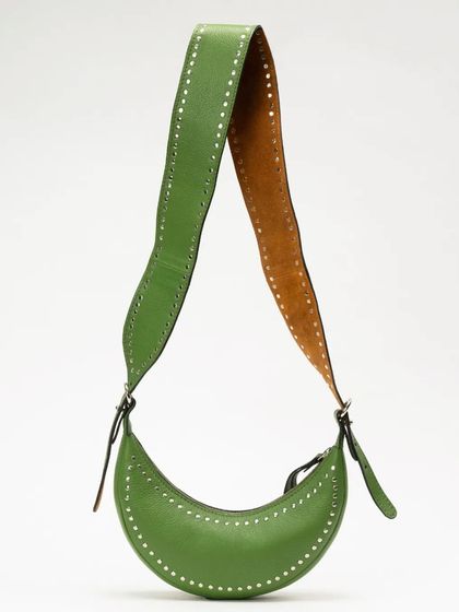 The Selena Studded in Jade, a vibrant green leather shoulder bag. The line of hand-applied studs follows the crescent shape, adding a subtle edge to the design.
