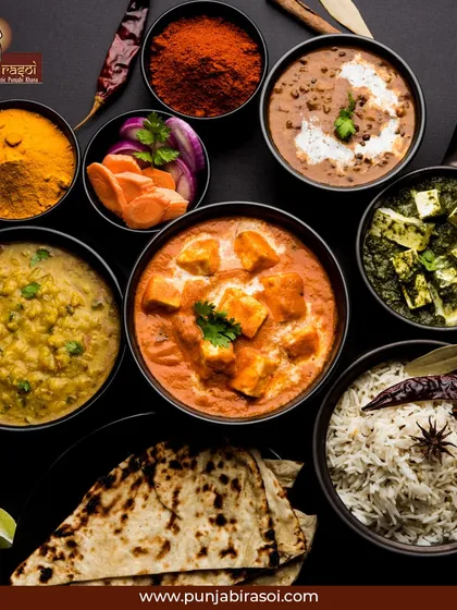 Punjab on a plate. A beautiful spread of our vegetarian dishes, spices, and breads, showcasing the heart of our cuisine.