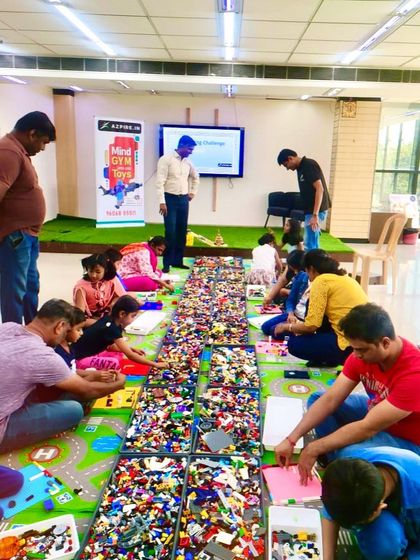 A wide shot showing the setup of our LEGO workshop, with a massive collection of bricks ready for builders. This image conveys the hands-on nature of the event.