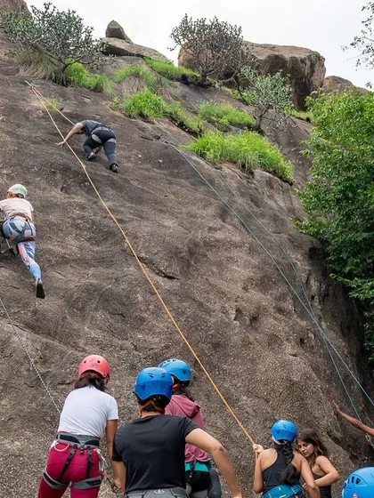 Two beginners learning side by side on the rock face at our women led workshop. Our instructors ensure a safe environment with multiple top ropes, allowing new climbers to focus on movement and technique.