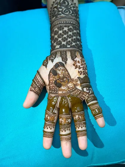 A close-up of the other hand, showing the detailed portrait of Satyavan.