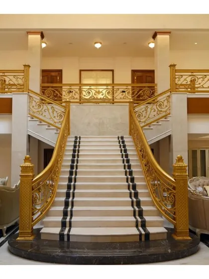 A centerpiece of a luxury residence in Kerala, this grand double staircase showcases our ability to execute opulent and intricate interior features. The combination of marble, ornate gold railings, and precise detailing creates an unforgettable statement.