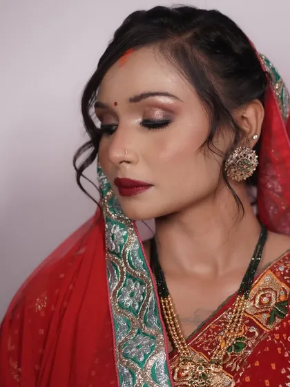 A side profile showing the delicate hairstyling and how the makeup enhances her features.