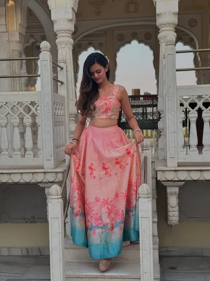 A photoshoot in a beautiful palace-like setting. The right location and outfit can make you feel like royalty, which is the vibe I aim for in my sangeet choreography.