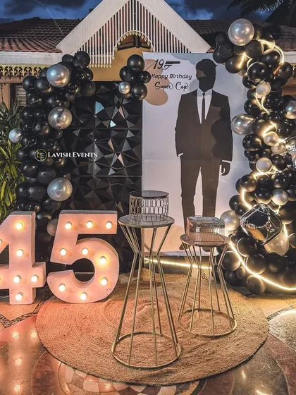 We can execute any theme with a modern twist. This "Supercop" birthday party features a sleek black and silver color scheme, marquee numbers, and a custom silhouette backdrop.