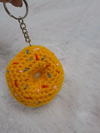 This angle shows the sturdy metal chain and ring I use for all my keychains, ensuring your cute accessory stays securely attached.