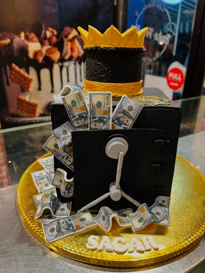 Another view of the money safe cake, a fun and extravagant design for a big celebration.