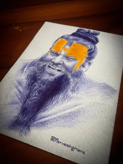 The completed portrait of Premanand Ji Maharaj. The combination of the detailed blue pen sketch and the bright orange tilak creates a striking image that captures his devotional energy.