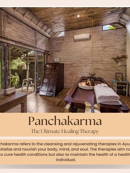 Our treatment rooms are designed to be peaceful sanctuaries. This space, with its wooden architecture and view of the garden, provides a calming environment for your Panchakarma therapies.