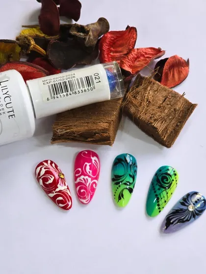 Another view of the swirl-patterned nail art, highlighting the clean lines and bold color choices.