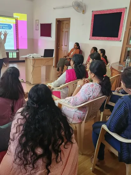 A wide shot of the workshop on communication strategies in progress. These sessions ensure our team is equipped to handle every classroom situation with empathy and skill.