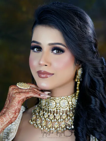 A stunning engagement look for a bride-to-be. The soft smokey eyes and glossy nude lips create a glamorous yet sophisticated style, perfect for celebrating the start of a new chapter.