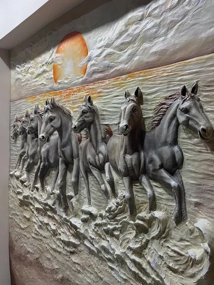 A side view of the deluxe horse mural, showing the high-relief sculpting of the horses running on the textured ground.