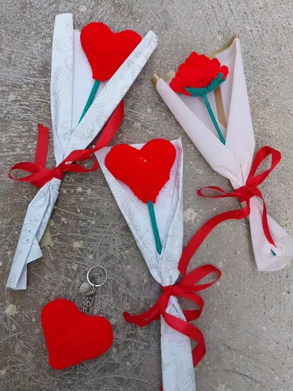 Some of my Valentine's Day orders, including heart bouquets, a rose bouquet, and a heart keychain.
