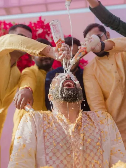 The Haldi chaos continues, with the groom getting a full shower from his friends.