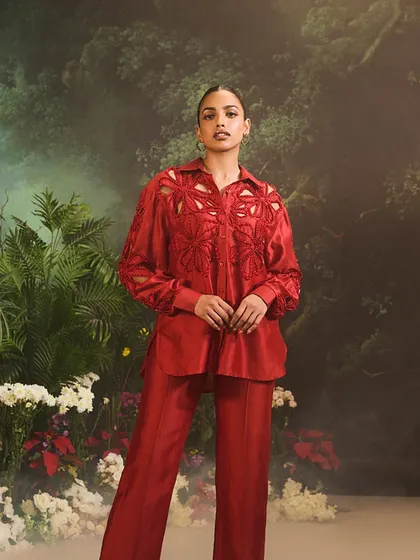 A confident pose in the red Lunara Co-Ord Set, perfect for the woman who appreciates artistry in fashion.