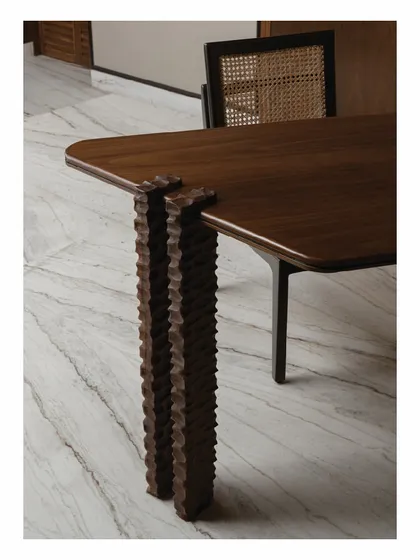 We believe in the poetry of details. These hand-carved legs for a study desk are a testament to the incredible skill of local artisans we collaborate with. Each groove is meticulously crafted, transforming a simple table into a unique piece of functional sculpture.
