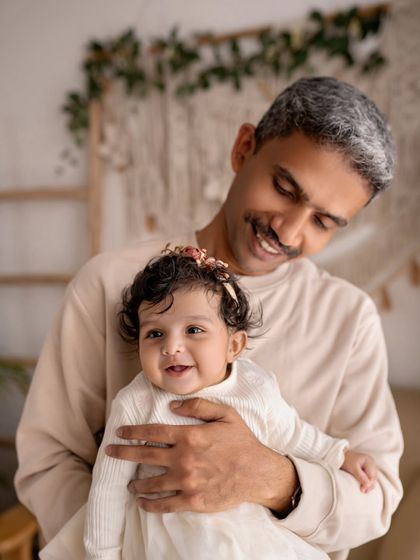 A father and daughter sharing a sweet smile. Their connection is so heartwarming.
