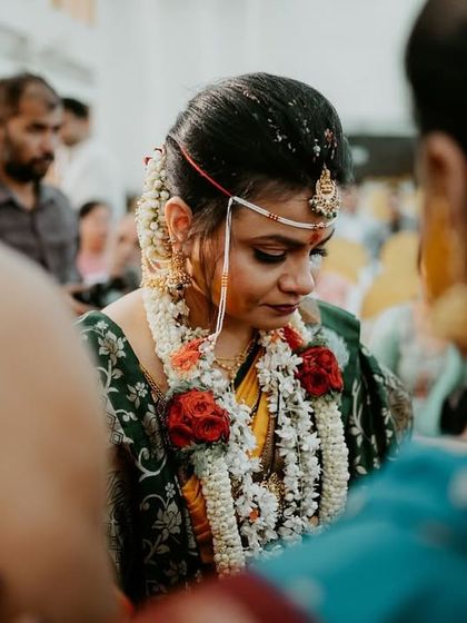 A bride's emotional moment during her ceremony, captured from a distance to preserve the intimacy of the scene.