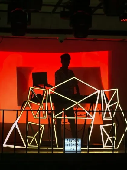 Setting the stage for an epic night. This silhouette shot shows my unique, custom-lit DJ console at a Fandom Nights event. I believe the DJ booth should be as visually exciting as the music.