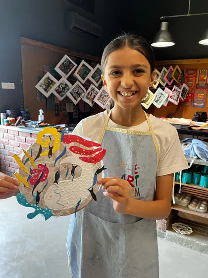 Look at that smile. This is the best part of my job, seeing a young artist proudly show off a piece they created with their own hands. This collagraph project allowed her to play with textures and shapes to make something truly unique.