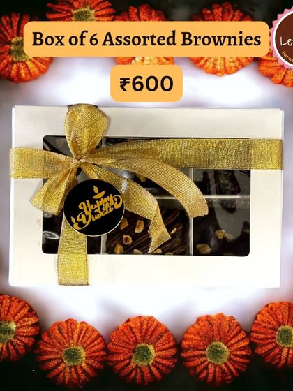 A festive presentation of my assorted brownie box, tied with a golden ribbon and a "Happy Diwali" tag. I can also customize these with a company logo for corporate orders.