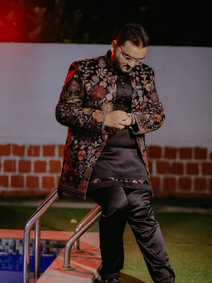 Another angle of my popular black floral embroidered Indo-Western jacket. This shot shows how the outfit looks from the side, highlighting the detailed embroidery on the sleeves and the sleek silhouette of the matching kurta and pants.