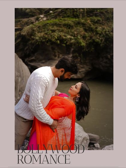 A beautifully framed shot titled "Bollywood Romance," capturing a classic romantic pose by the river in Manali.