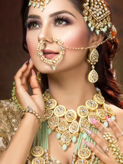 It's all in the details. This is a close-up of one of my premium Polki and mint-beaded bridal jewellery sets. You can rent the complete set, including the nath, maang tikka, and haath phool.