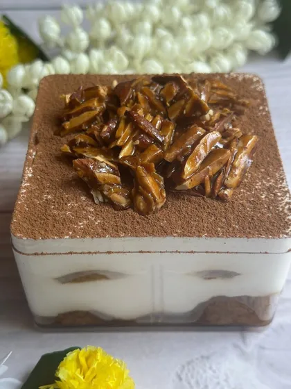 This Coffee Rasgulla Tiramisu Tub is another one of my Diwali specials. It layers coffee-soaked rasgullas with creamy mascarpone and a crunchy almond praline topping.