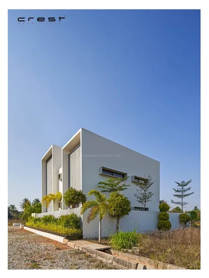 A comparison of the final built 'Framed House' and its initial concept model. This shows the successful translation of our design vision from a small-scale model to a full-scale architectural reality.