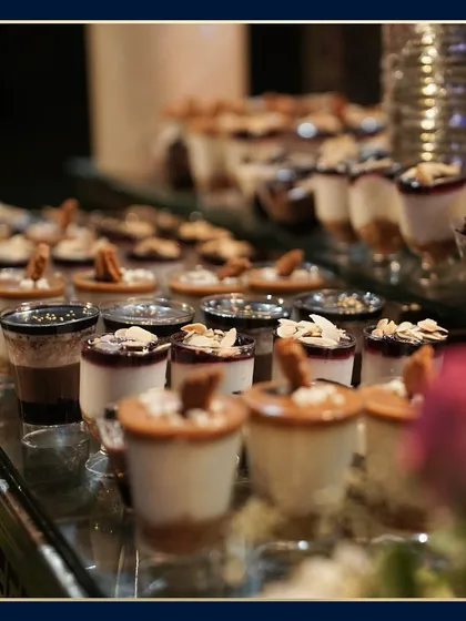 A close-up of our assorted dessert shots. This image highlights the rich layers and delicate toppings, from chocolate and caramel to fruit compote and toasted almonds.