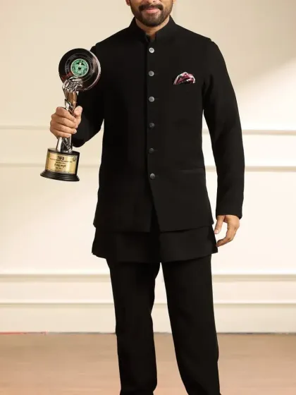 Actor Allu Arjun looking sharp in a classic black Jodhpuri suit I designed. This timeless piece is perfect for award ceremonies and formal gatherings, offering a clean silhouette with a touch of traditional elegance.
