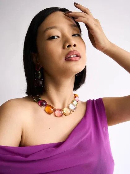 A close-up showing the soft lip color and clean skin, a perfect canvas for a fashion-forward shoot.