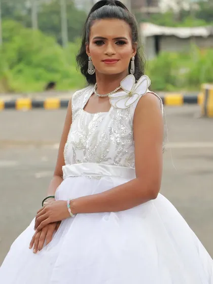 Another beautiful example of a student's work on a model in a white gown, perfect for their professional portfolio.