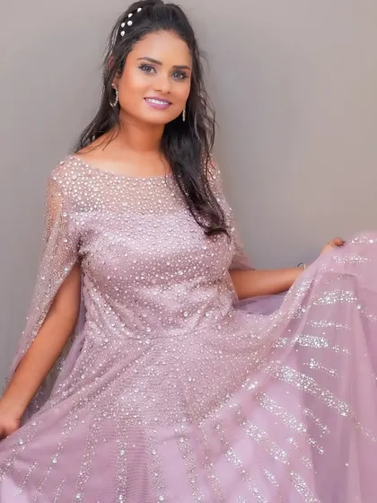Feel beautiful and confident in this flowing lavender gown, available for rent for your special day.