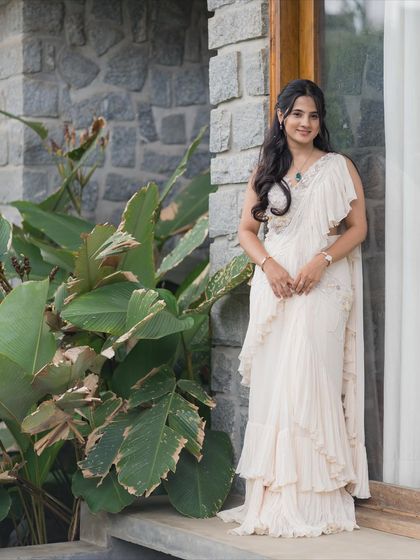 A smiling portrait that shows how a minimal look can be incredibly elegant and impactful.