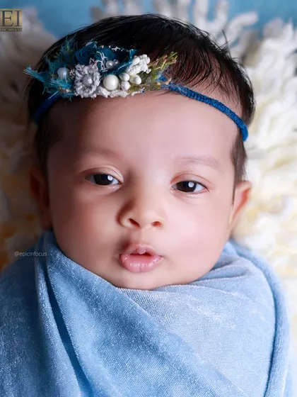 Another adorable awake shot, this time with a curious, pouty expression. We capture the full range of your baby's personality.