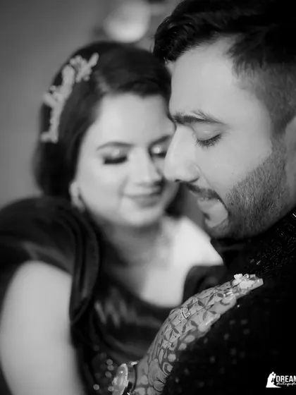 An emotional black and white close-up from a ring ceremony, capturing the deep connection and affection between the couple.