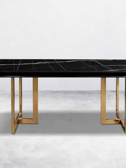 For a dramatic look, this dining table pairs a black marble top with a geometric gold-finished base.