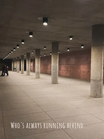 A wider view of the underpass, showing me still working to get the shot. The text overlay continues the story of a photographer's dedication.