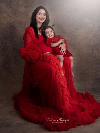A mother-daughter portrait during a maternity shoot, showcasing the special bond as they prepare to welcome a new family member.