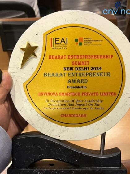 A close-up of our "Bharat Entrepreneur Award" trophy. This award from the Entrepreneurs Association of India is a symbol of our dedication to driving impactful change through sustainable solutions.